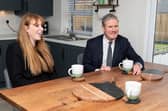 Labour leader Sir Keir Starmer chats with residents, Ryan Barker and Catherine Watkis, inside their newly built home during a visit to a Leyland housing development with Deputy Leader Angela Raynor.  Photo: Kelvin Stuttard