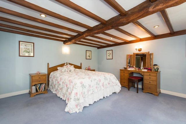 Estate agent Knight Frank says the six-bedroom house is nestled into the surrounding woodland and hillside with mature gardens, stream and waterfalls within the 40-acre estate.