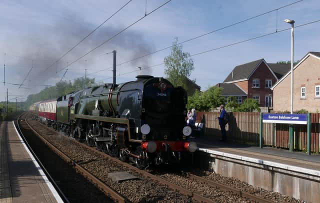 The 34046 Braunton steam train hauling the Settle and Carlisle Fellsman Rail tour into Euxton Balshaw Lane Station.