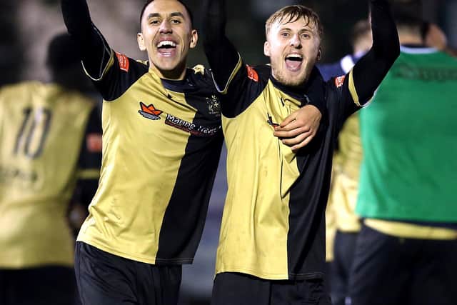 Marine's Josh Hmami and James Barrigan (right) celebrate their win after extra time of the Emirates FA Cup second round match at Rossett Park, Crosby (Photo: PA Wire/PA Images)