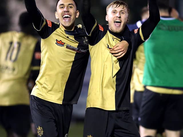Marine's Josh Hmami and James Barrigan (right) celebrate their win after extra time of the Emirates FA Cup second round match at Rossett Park, Crosby (Photo: PA Wire/PA Images)
