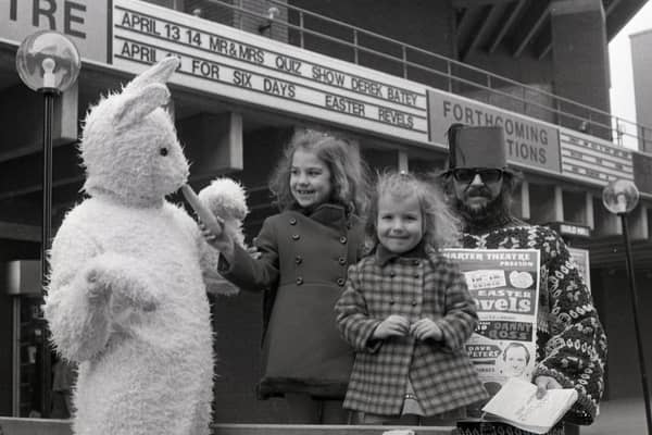 Jane and Janet Boyd, of Morecambe, are greeted by an Easter bunny - publicity for a special Easter Revels show being presented at Preston's Charter Theatre