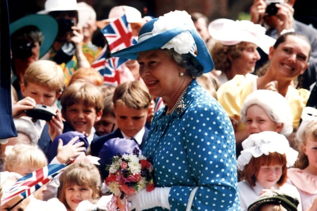 The Queen is greeted by excited children from Rossall School during her visit to the county