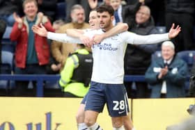 Preston North End's Tom Cannon celebrates scoring his side's third goal against Blackpool with teammate Alvaro Fernandez