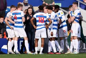 Gareth Ainsworth speaks to his Queens Park Rangers players by the side of the pitch