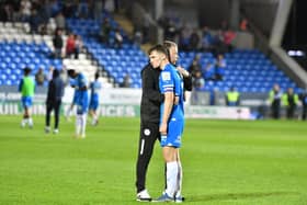 Harrison Burrows with Posh boss Darren Ferguson 