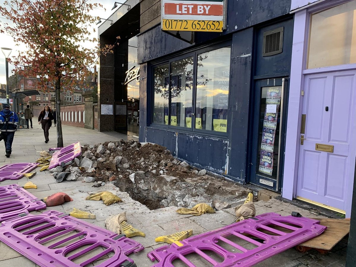 Huge hole in Preston city centre pavement 'left exposed deliberately' after barriers flattened