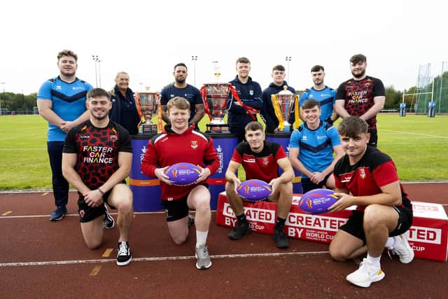 UCLan Men’s Rugby League team students with the Rugby League World Cup (2021) trophies at UCLan Sports Arena.