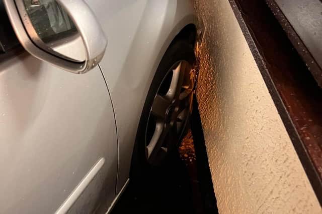 The car plunged into the wall after the driver had a handbrake fail