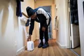Man adjusting dehumidifier