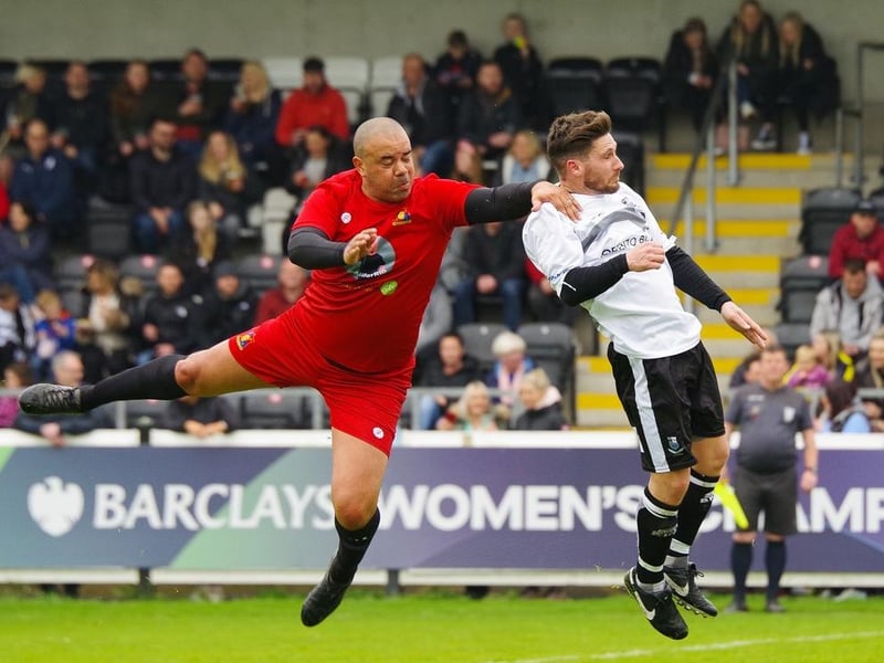 Marlon Broomes challenges for a header