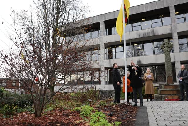 Chairman of Lancashire County Council, Peter Britcliffe raises the Red Rose flag ahead of Lancashire Day. He says the county should be proud of its famed friendliness