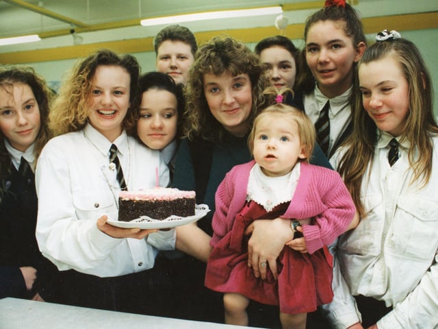 Schooldays are happy times for little Leanne Rimmer - even though she is only a year old. For the tiny Preston tot has been a regular at Ribbleton Hall High School, spending the first 12 months of her life as the focal point of "family concern" classes at the school. Birthday girl Leanne is pictured with mum Tricia and some of the pupils who took part in the special classes