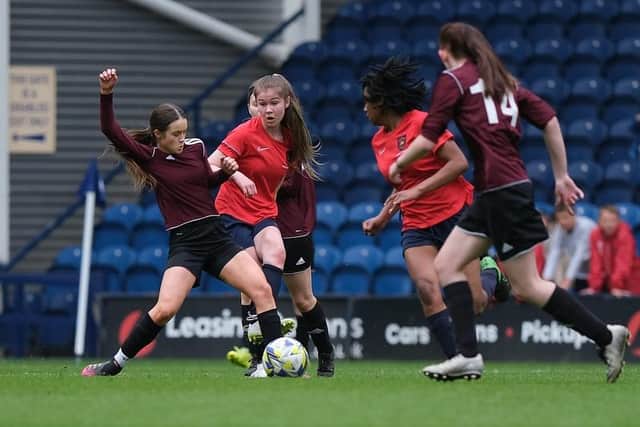 Action from the Guild Cup final between Archbishop Temple (red kit) and Our Lady's RC High School (maroon kit). Pic: John Shirras - @john_shirras