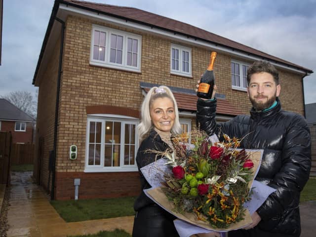 First time buyers Dom Johnson and Steph Hatton outside their Anwyl home