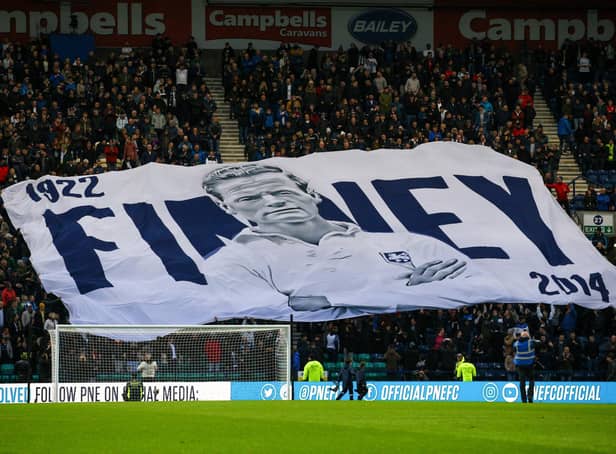 Preston North End fans with the giant Sir Tom Finney surfer flag