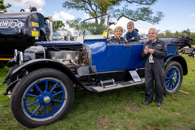 Rod and Elaine Robinson with grandson Harry and their Stanley 730 Steam car.