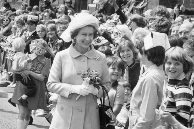 Smiling faces line up to meet the Queen during her Preston visit in 1977