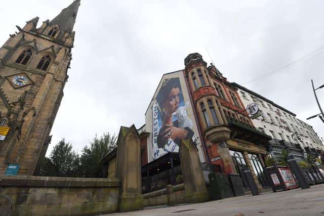 The mural watches over Preston Minster