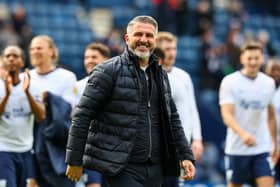 Preston North End manager Ryan Lowe celebrates with fans at the final whistle