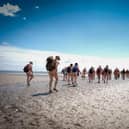 Naturists will take a stroll across Morecambe Bay this June.