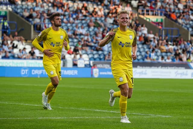 Ali McCann celebrates scoring his side's third goal.