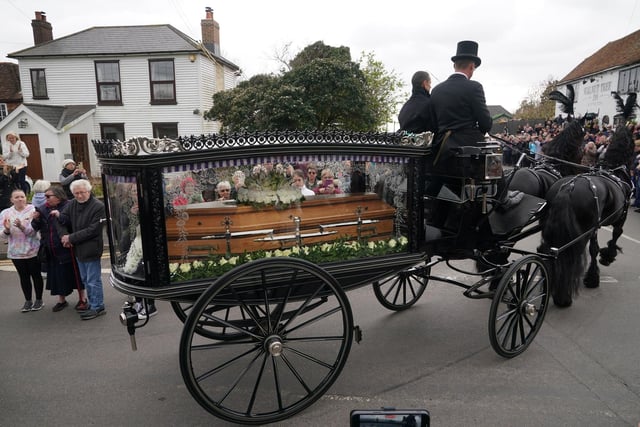 The funeral cortege of Paul O'Grady travels through the village of Aldington, Kent ahead of his funeral at St Rumwold's Church.