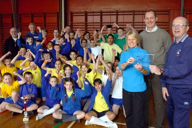 Fulwood High School and Art College and Preston Harriers Partnership did some sporting events with the Fulwood cluster of primary schools. With the trophy are, Julie McCormick, school sports co-ordinator, Craig Vickers, manager of the school sports partnership, and Bob Welfare, coaching co-ordinator at Preston Harriers