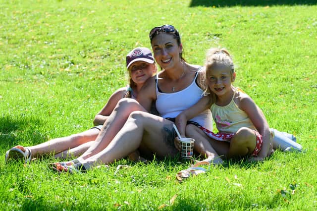 Nicola, Dorota and Victoria Gawron enjoying the sun in Avenham Park, Preston. Photo: Kelvin Stuttard