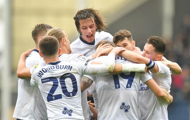 Preston North End's Emil Riis is mobbed by team mates after scoring his team’s opening goal.