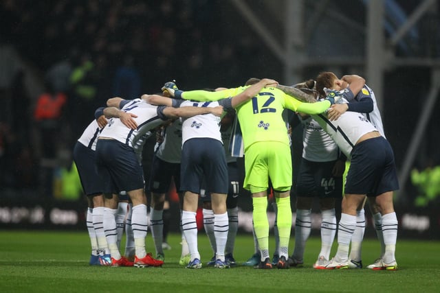 Preston North End players do a team huddle before the game