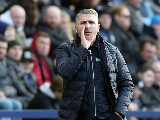 Preston North End manager Ryan Lowe shouts instructions to his team from the technical area