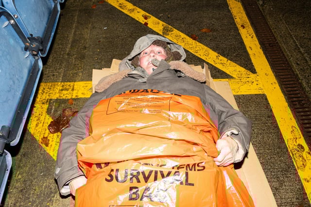 David Sergeant tries to keep warm during the big PNE Sleep out at Deepdale. Photo: Kelvin Lister-Stuttard