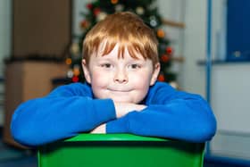 Tyler Bruce (7) will hand out 10 gift bags to the needy on Christmas Eve . He has bought the items from his own pocket money. Photo: Kelvin Lister-Stuttard