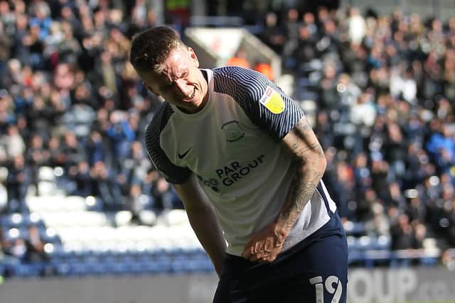 Emil Riis pulls up injured after scoring PNE's opening goal against QPR at Deepdale