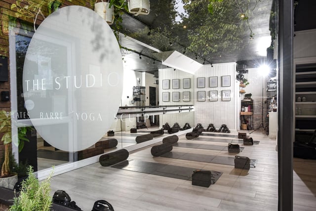 The studio is kitted out with yoga mats and is ready to welcome people to an exercise class.