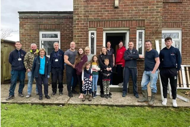 Volunteers who carried out a DIY SOS to prepare the empty house for its new family (Image: Rossall School)
