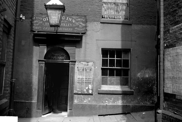 This picture of the Old Dog Inn on Church street shows the back entrance and was taken around 1902