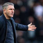 Preston North End manager Ryan Lowe shouts instructions to his team from the technical area