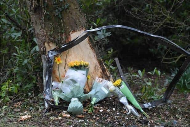 Floral tributes at the crash scene in Runshaw Hall Lane, Euxton.