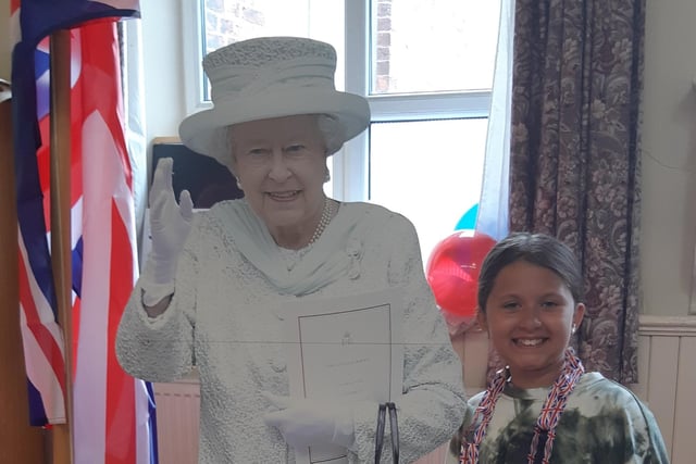 This young lady managed to get her picture taken with the 'Queen'