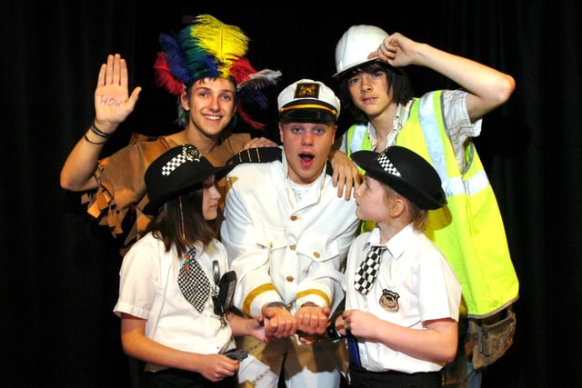 Students at Walton-le-Dale Arts College in Bamber Bridge dressed up as costumes depicting different occupations as part of National Poetry Day. Pictured clockwise: Ben Jones, Simon Lincoln, and Chris Pope as the Village People, with Jodie Dixon-Maher and Laura Simpson as police officers