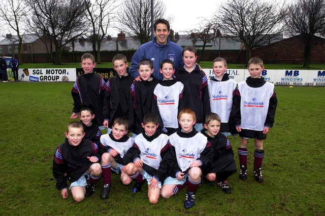 Liverpool and England midfielder Jamie Redknapp meets players from Leyland Albion FC during the launch of the Football Association Charter Standard Clubs project at Lancashire FA headquarters in Leyland