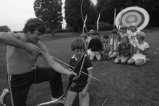 These boys landed a perfect score - a summer holiday with a difference. While their classroom contemporaries looked forward to sea and sand, they went back to school. The group were among 170 children from Preston, Clitheroe and Blackburn who signed up for lessons at Stonyhurst College in the Ribble Valley. Pictured: Archery teacher Allan Lovegrove gives Mark Haydock of Whalley some shooting hints