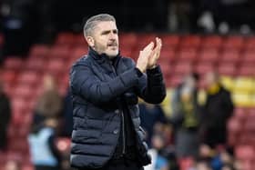 Preston North End's manager Ryan Lowe applauds his side's travelling supporters at the end of the match against Watford