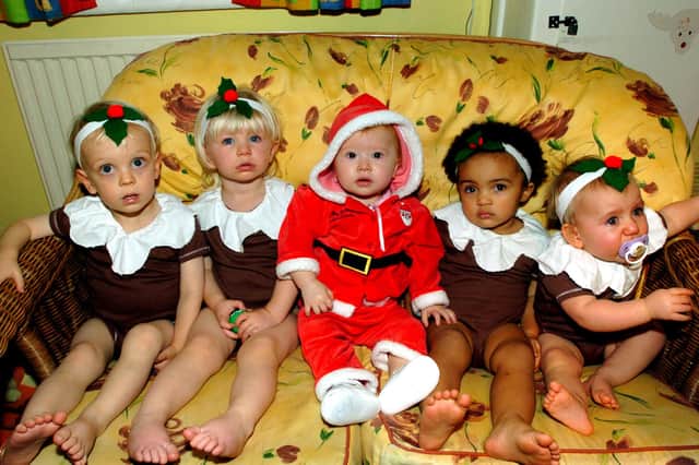 Father Christmas with his Christmas Puddings in the baby section of Walmer Bridge Day Nursery