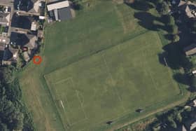 A red circle marks the spot where a hole is being dug in a Lancaster field.