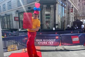 Jess as a balloon modeller for Lego store, London