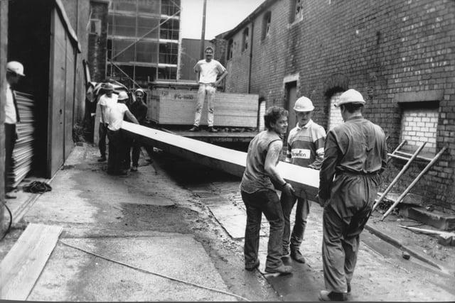 A giant timber is unloaded ready for installation during the redevelopment of Cotton Court in Preston, back in 1989