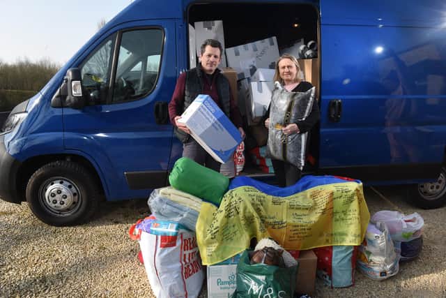 photo Neil Cross: Ukrainian ex pats Oryslava and Ostap Anyonyuk, desperately need some storage space for the amount of donations they've received
